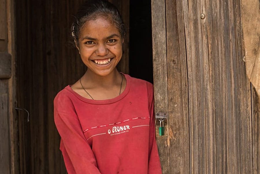 Timor-Leste: Clothing, Apparel, Human, Person, Sleeve, Smile, Face, Female, Wood, Long Sleeve, Girl, Plywood, Woman