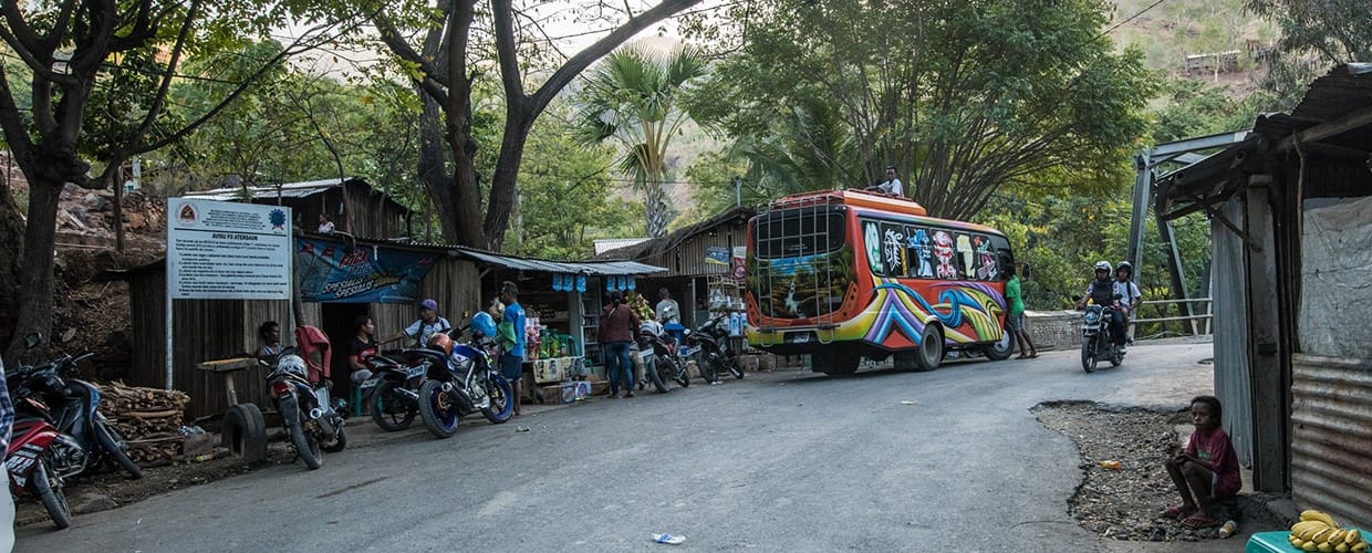 Timor-Leste: Human, People, Person, Scooter, Transportation, Vehicle, Bicycle, Bike, Cyclist, Sport, Sports, Female, Path, Trail, Tricycle